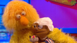Een baby is klant voor de band